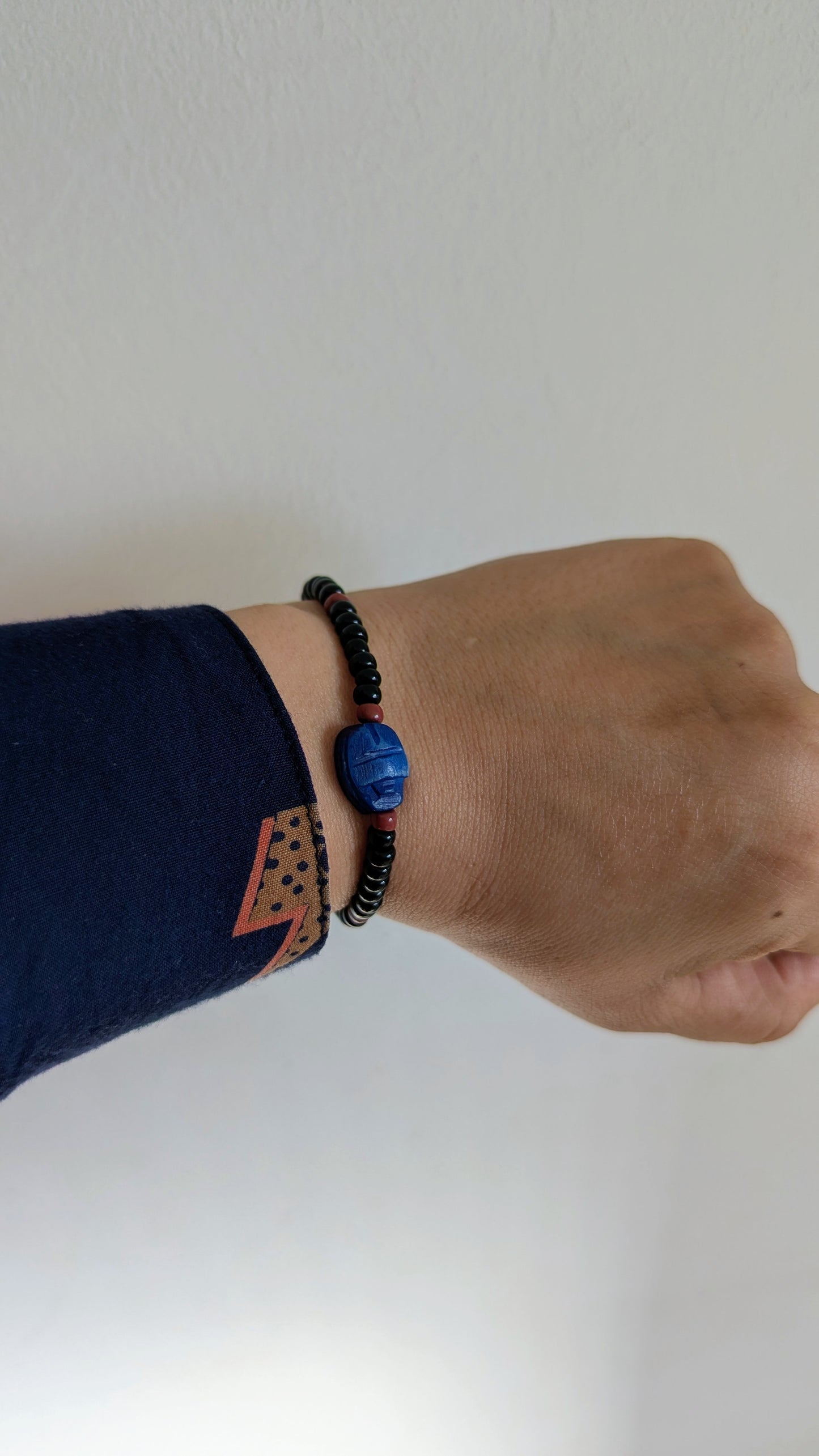 scarab bracelet worn on a hand