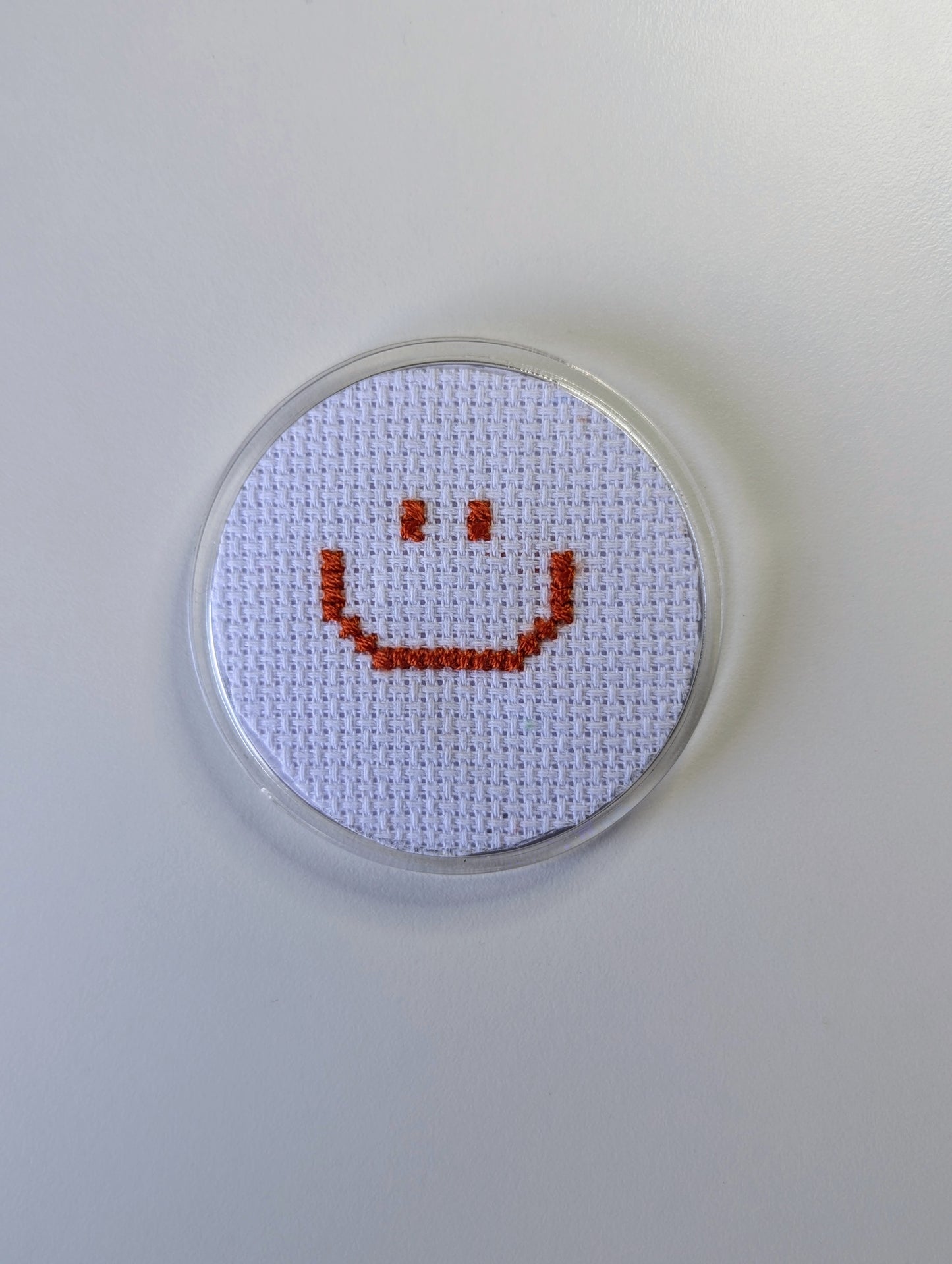 smiley face badge