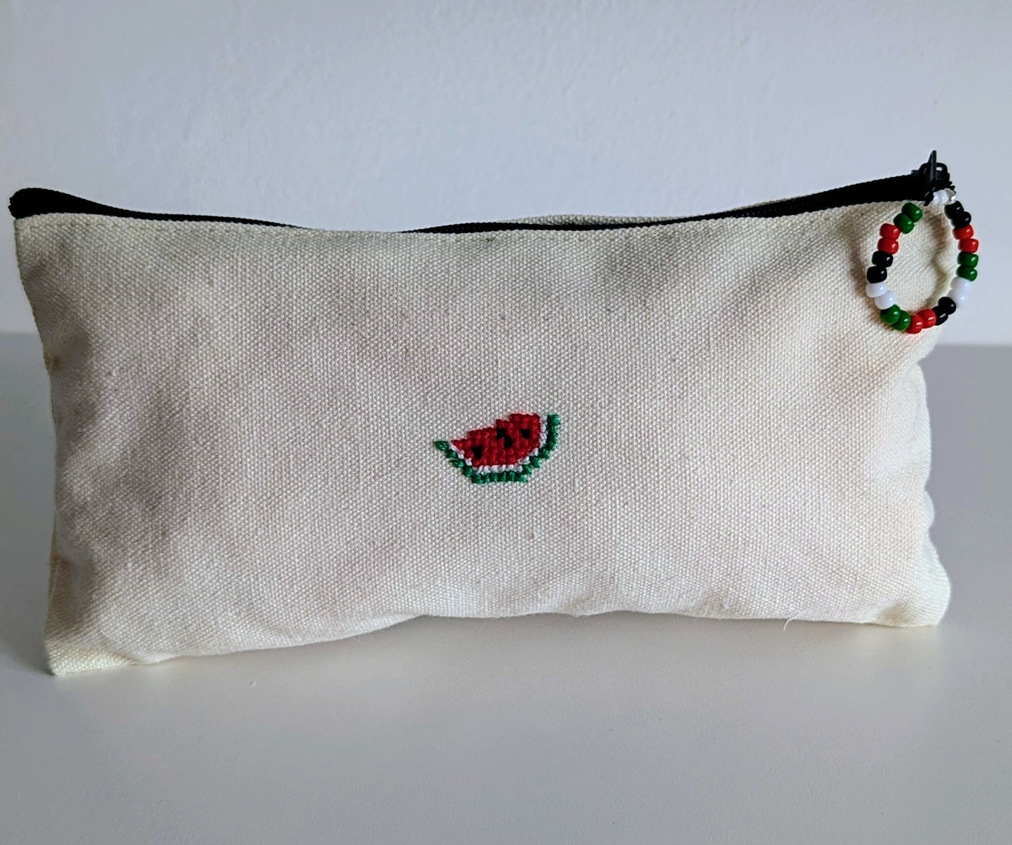 Cotton canvas pouch hand embroidered with watermelon.