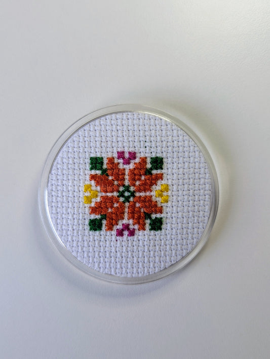 najma pin badge