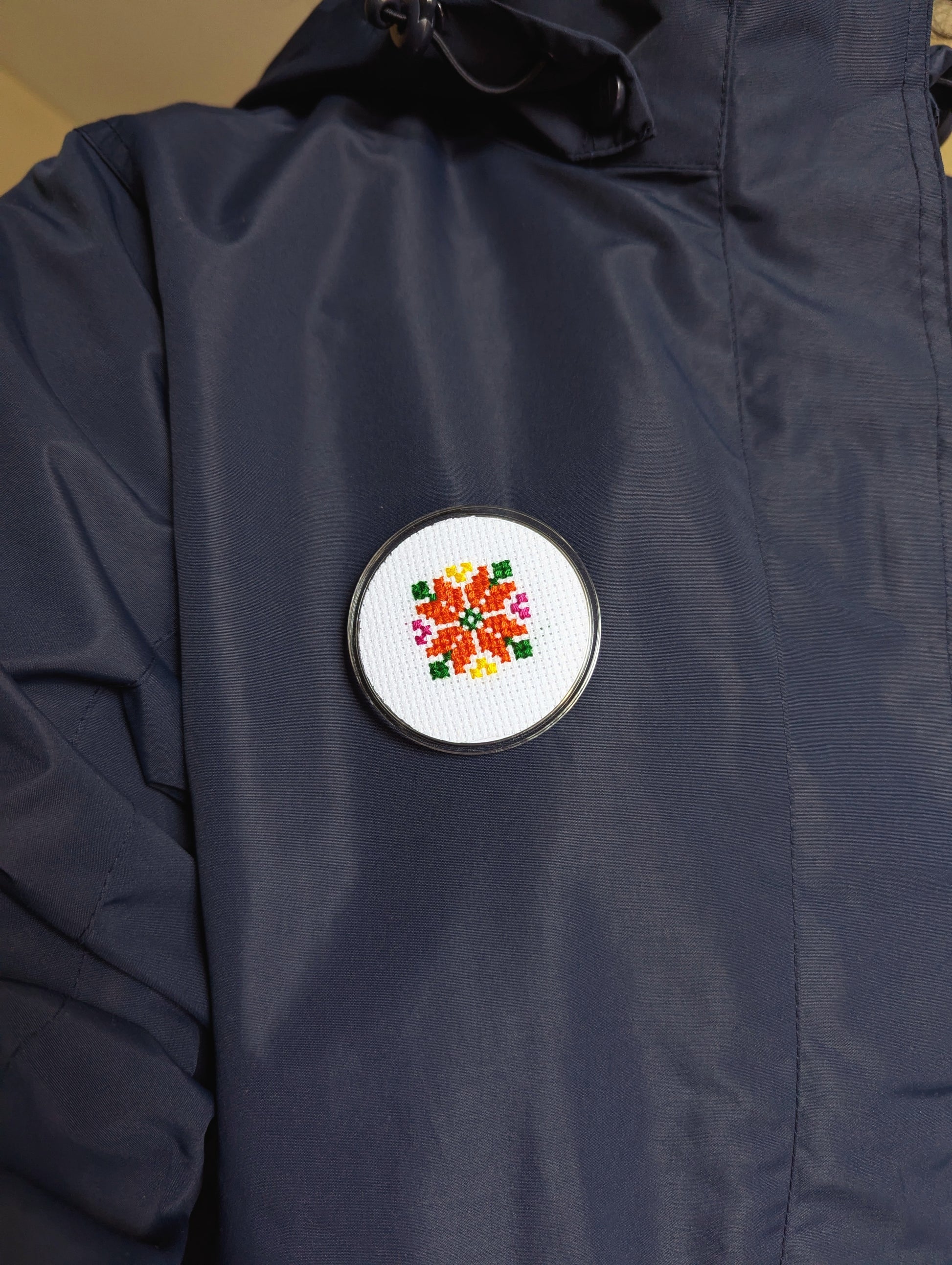 najma pin badge