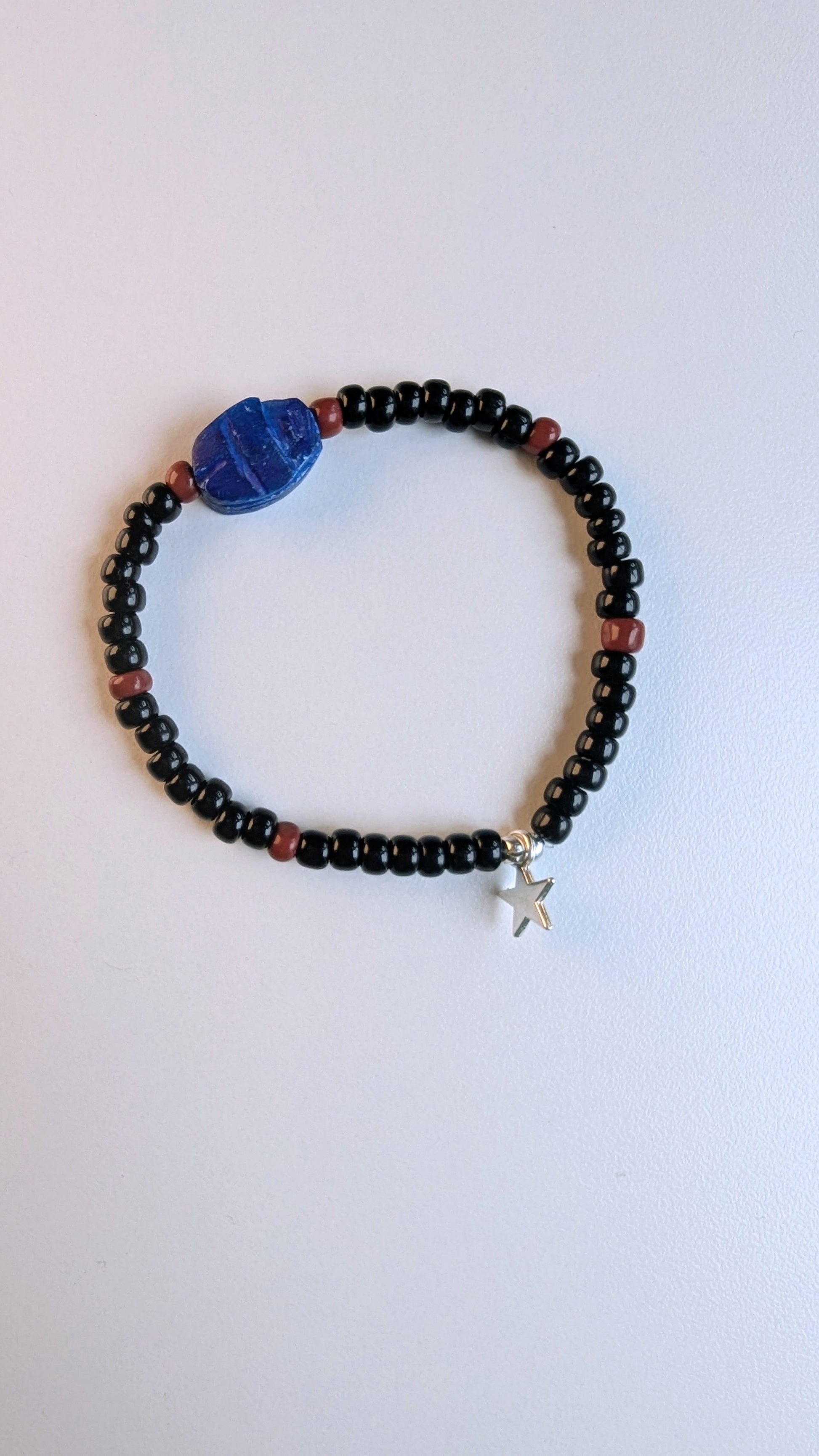 scarab bracelet with black and brown beads